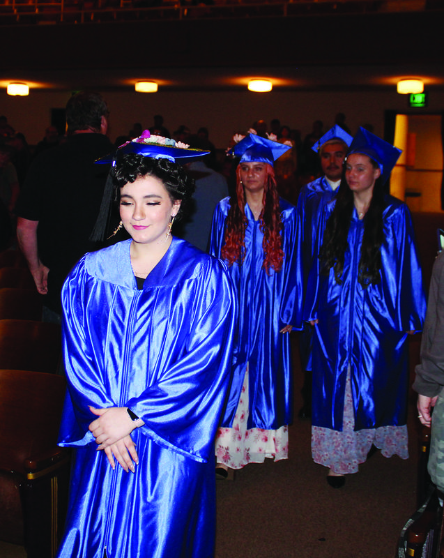 Students from Resource Link Charter School make their way to their seats to open the commencement ceremonies Thursday.