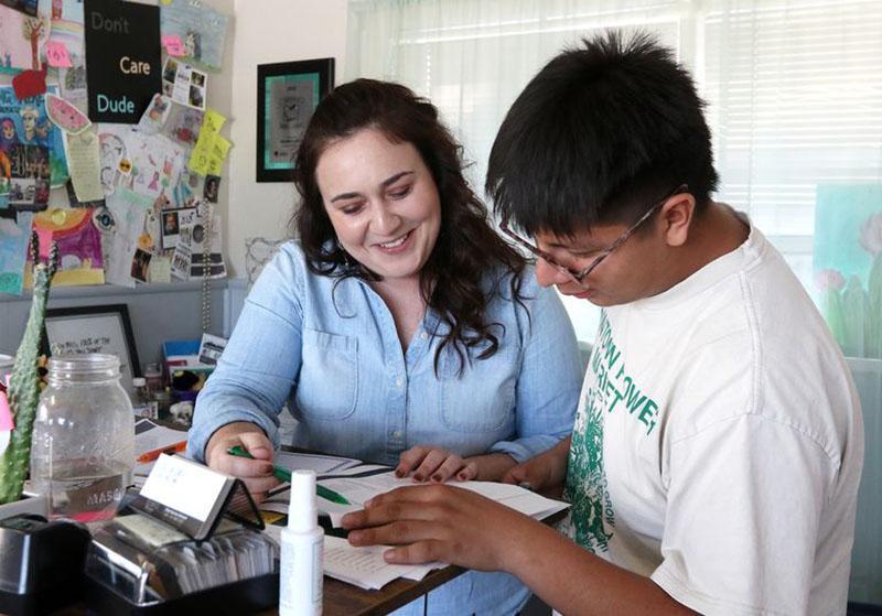 Melinda Torres helping a student