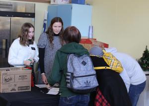 Students receiving stockings