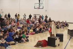 Students watch performers