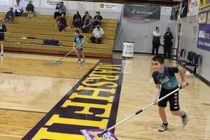 Boys sweeping floor