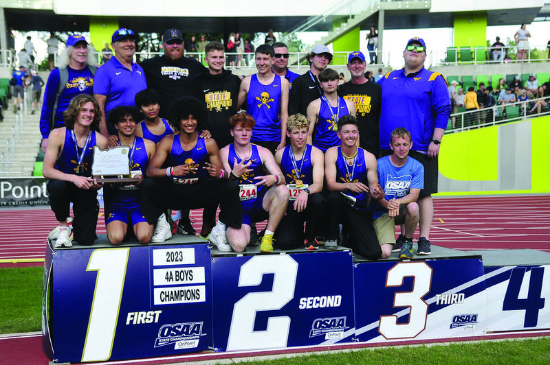 The Marshfield boys track team celebrates a state title