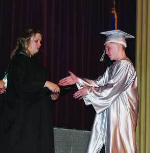 Buddy Lockwood accepts his diploma from Destinations Principal Kayla Crook during commencement ceremonies Thursday.