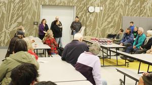 Board Chair Kim Brick talks to guests