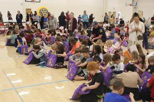 Students open gift bags