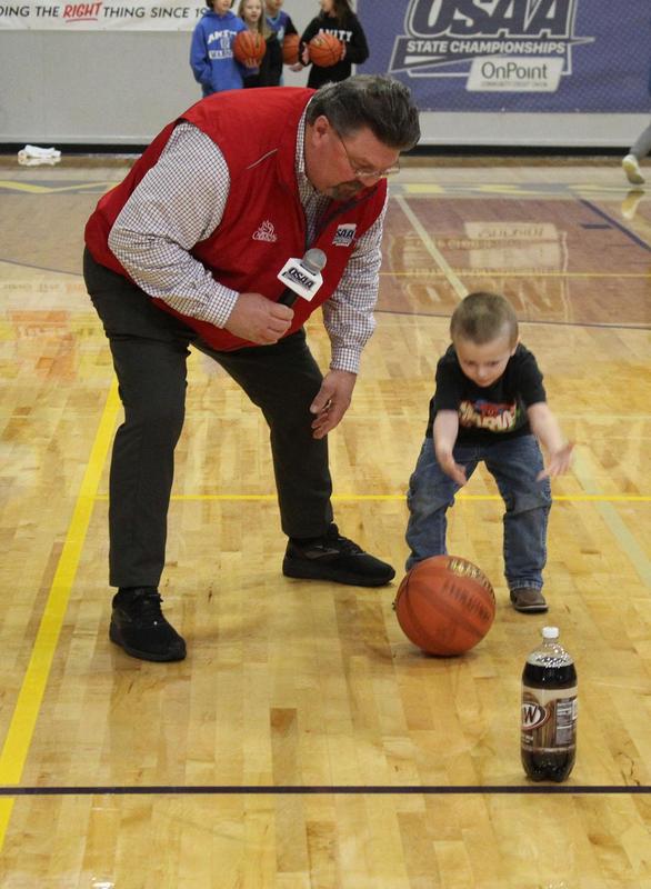 Greg Mulkey and child at halftime