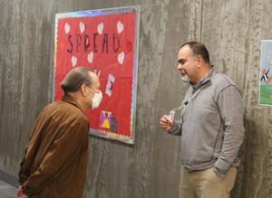 Principal Floyd Montiel visits with a guest