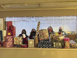 Charity Program students wrapping gifts