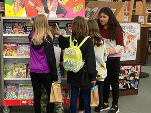 Students look at books