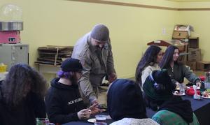 Chip Delyria serving students