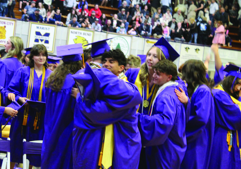 Members of the Marshfield High School Class of 2023 celebrate together after graduating Saturday night.