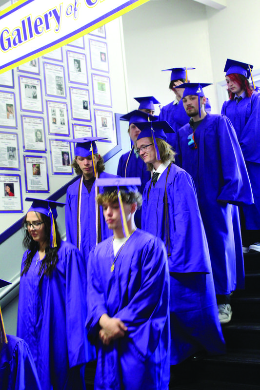 Members of the Marshfield High School Class of 2023 march down the stairs to enter the main gym.