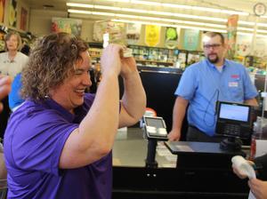 Charis McGaughy receiving the Golden Cart trophy