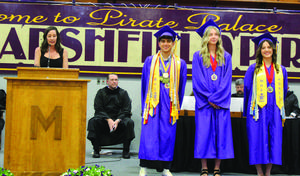 SWOCC professor Jessica Engelke Ryan, left, introduces the three Marshfield students who earned associates degrees while attending high school. Pictured are, from left, Alex Garcia-Silver, Emily Engelke Ryan and Emma Cornejo.