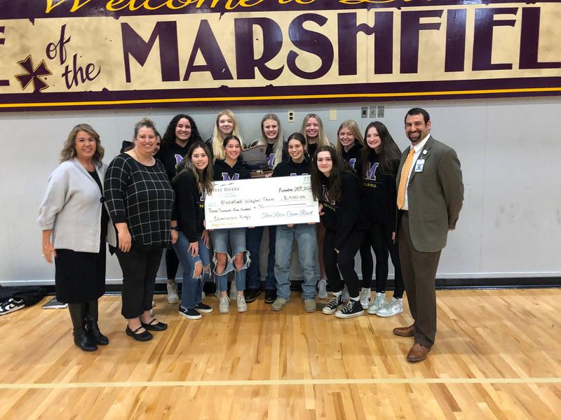 Volleyball team receiving check from Three Rivers Casino
