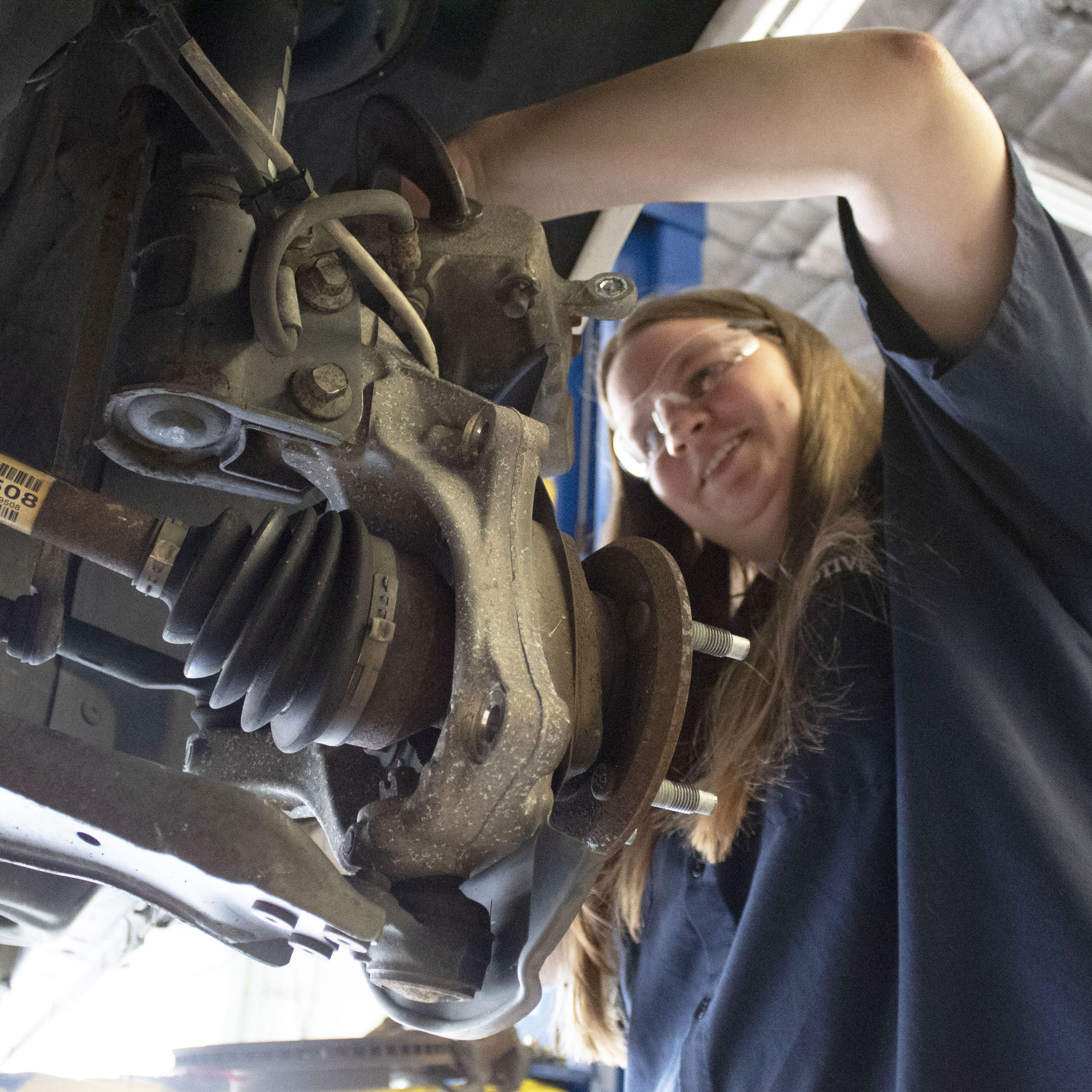 student working on car in auto class at CTC