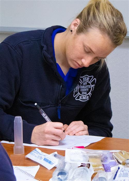 paramedic student working in class