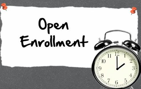  Picture saying open enrollment with a clock.