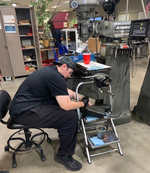 Jacob Youngs works on machine