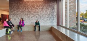 Students at the new Roosevelt Middle School enjoy varied seating areas for small-group learning, studying, and visiting, including this space in the foyer. Photo courtesy of Mahlum Architects Inc.