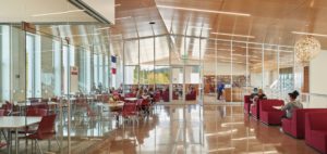 Students at the new Roosevelt Middle School enjoy varied seating areas for small-group learning, studying, and visiting, including this space outside the media center. Photo courtesy of Mahlum Architects Inc.