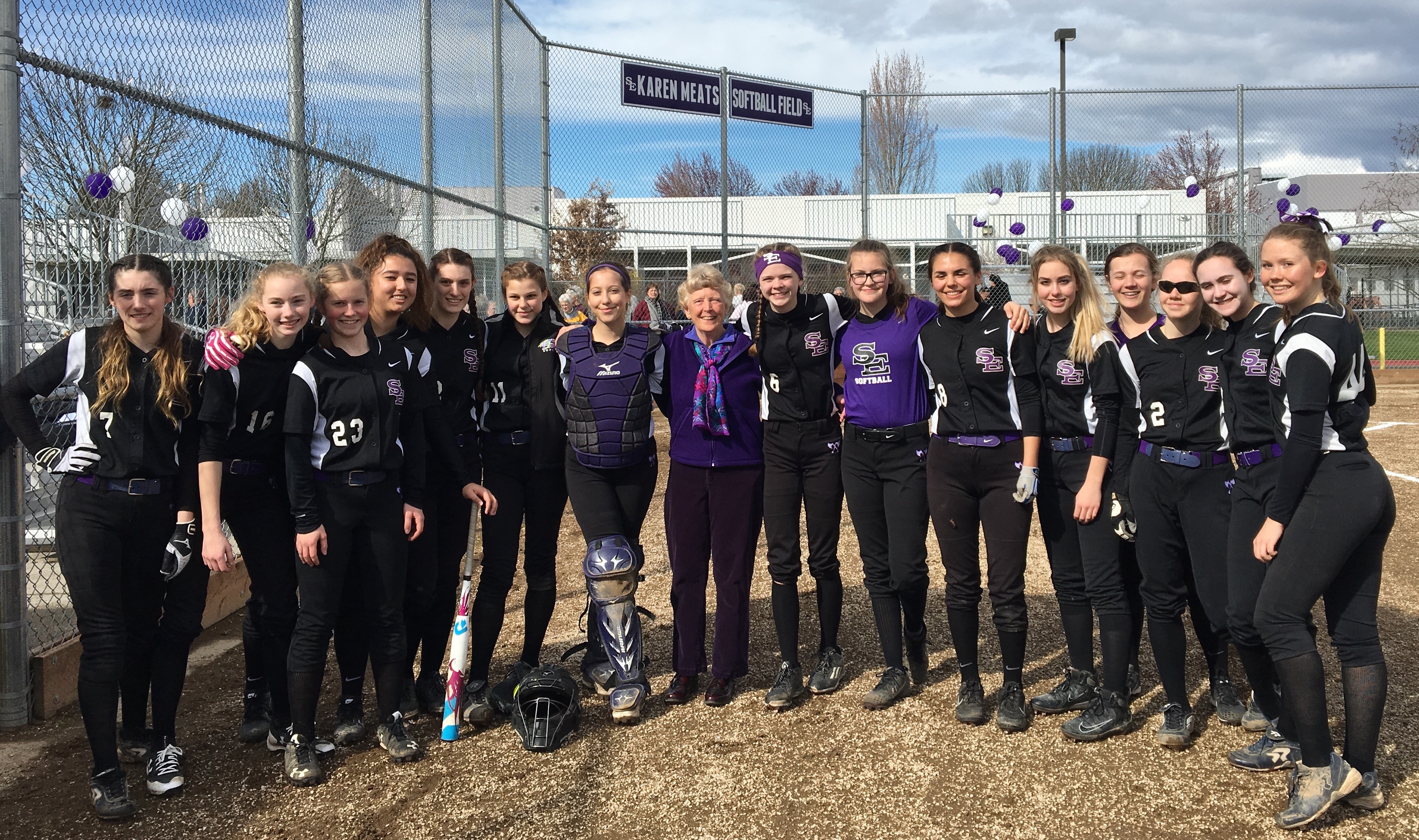 Honoree Karen Meats with South Eugene High School softball team