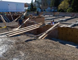 Workers rush to finish the second modular site.