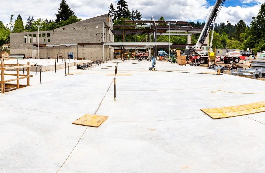 Edison update: a closer look at workers drying the new concrete slab.