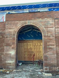 The new Edison Elementary School building features the brick-adorned arch, seen here under construction, that was a beloved hallmark of the previous school building.