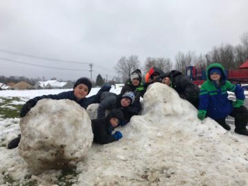 Students playing in the snow