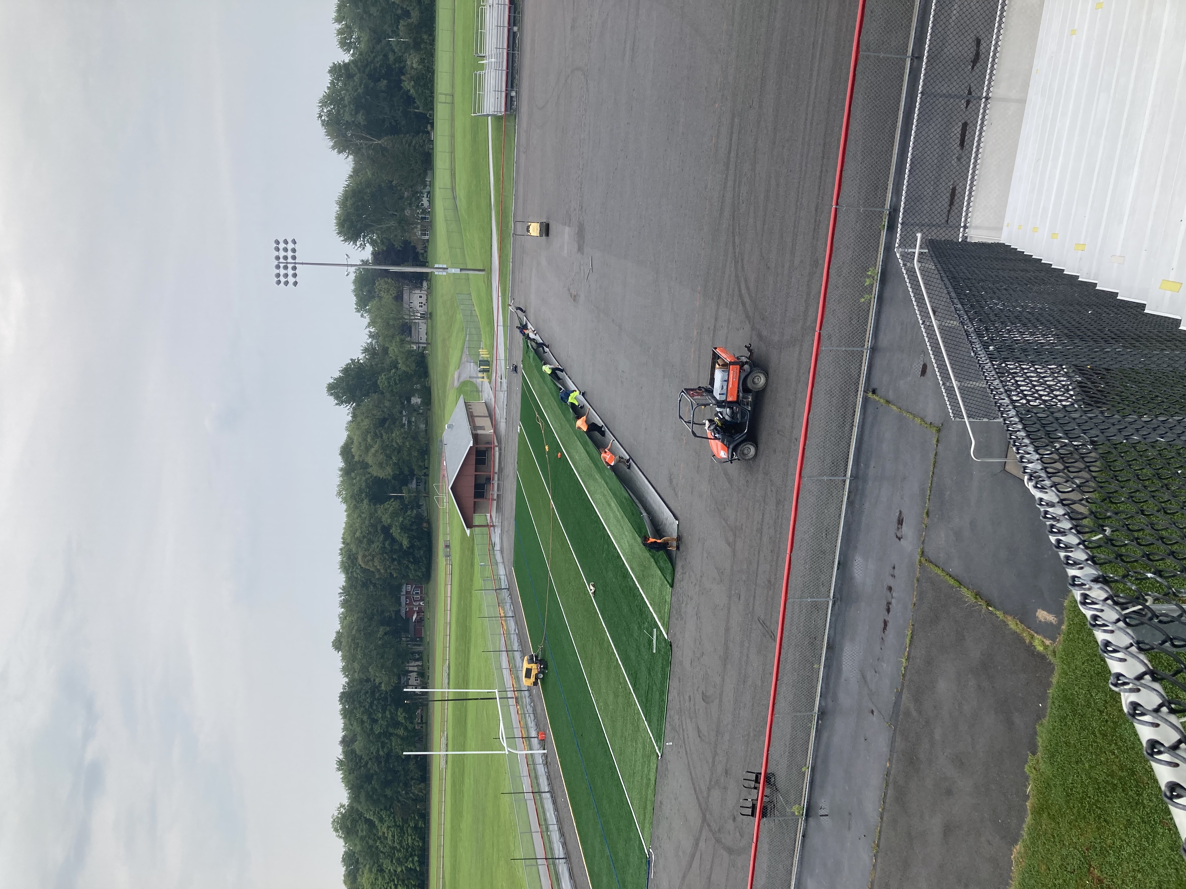 stadium turf being laid in at Fairport High School's field