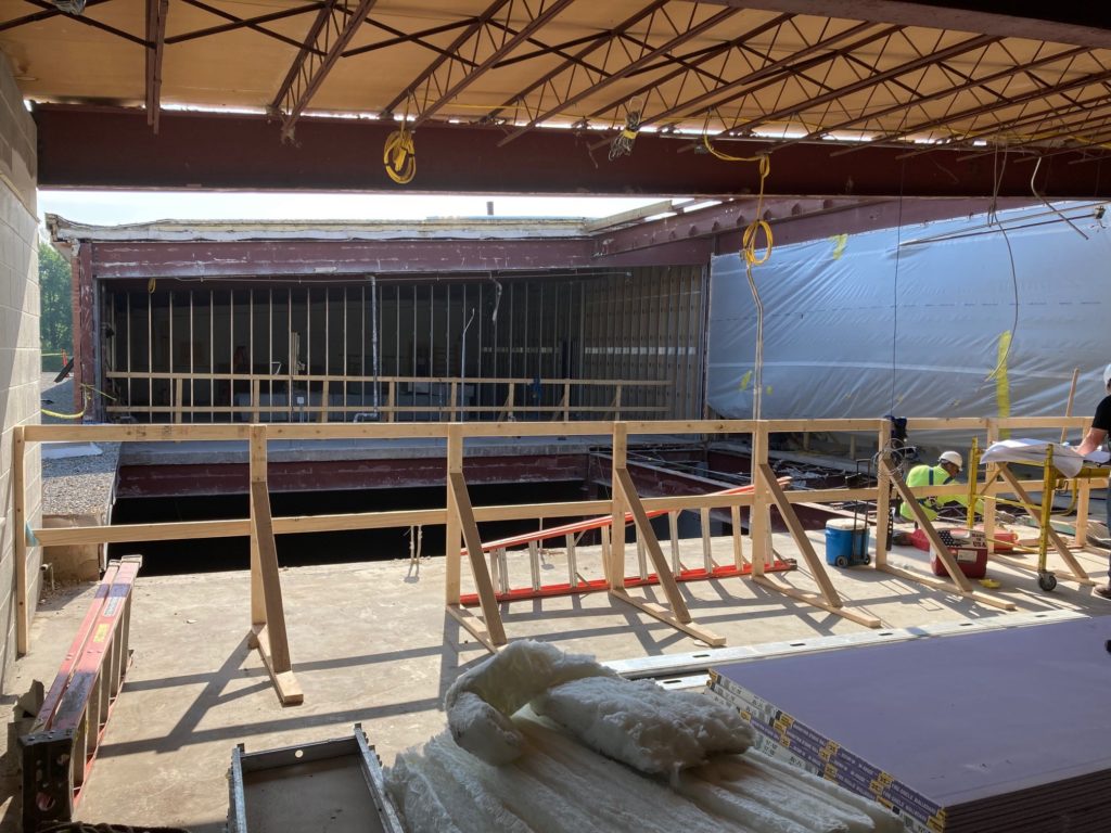 View through the scaffold of a demolished second floor classroom