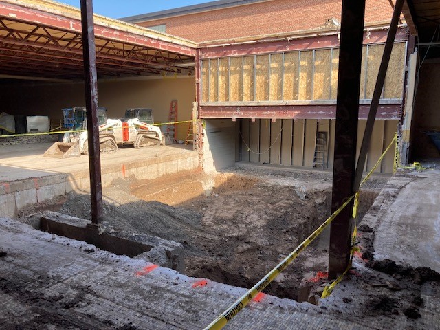 Excavation work done on the floor of an exposed courtyard