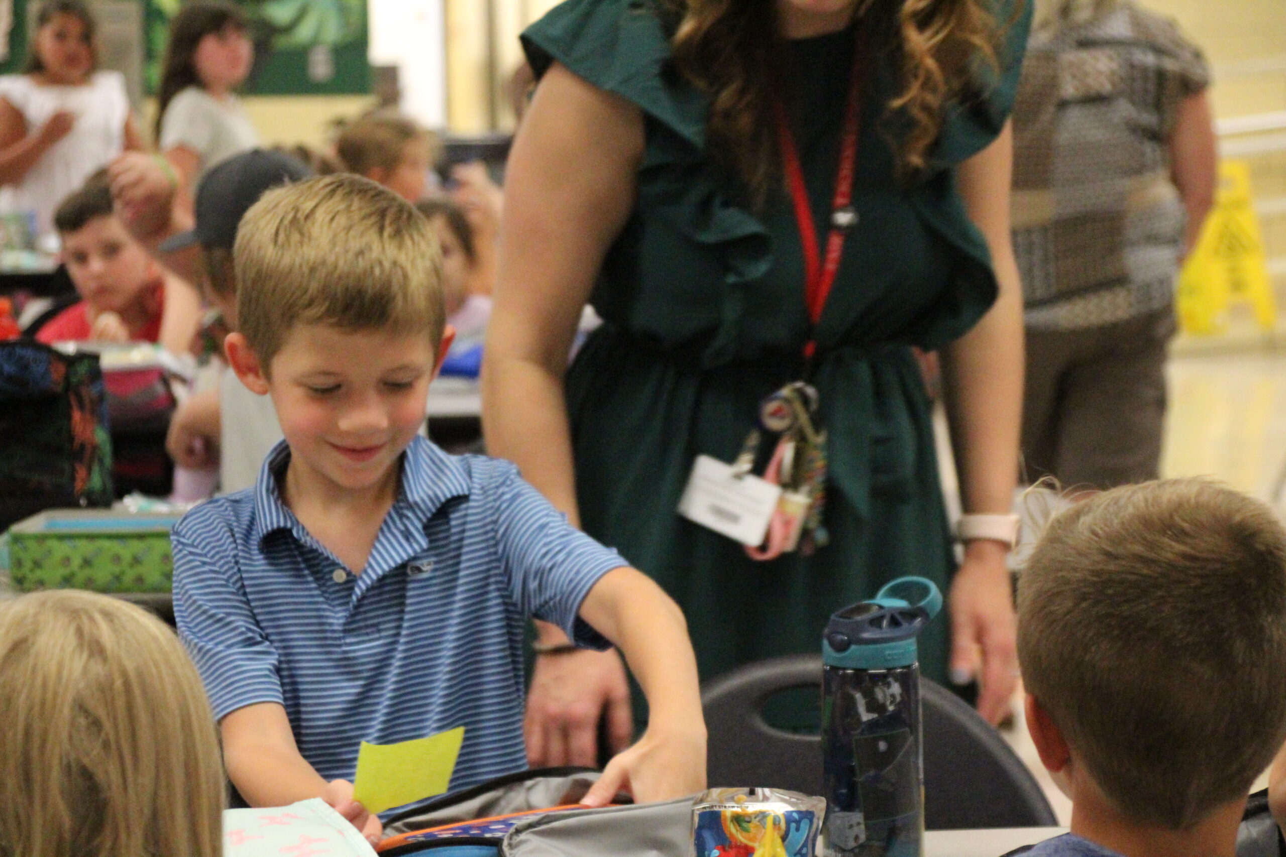 Elementary school student getting ready to eat their lunch