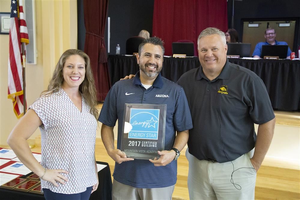 Group photo of students and staff with energy star awards.