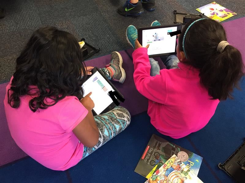 Students working on the iPads