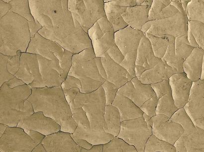 clay-looking background with textured cracks in it