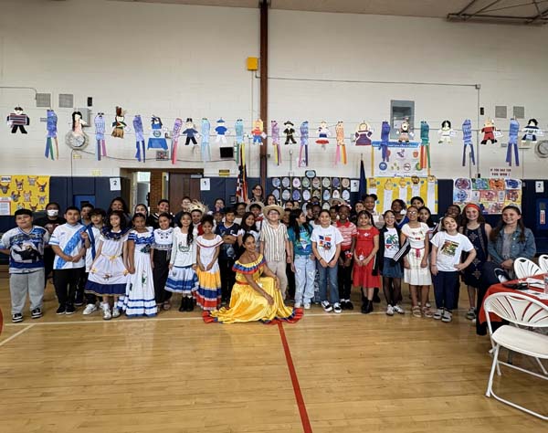 Freeport Public Schools’ Leo F. Giblyn Elementary School came alive with its lively celebration of global cultures on May 15 during its annual International Day luncheon. The school’s fourth grade tradition honors the rich cultural backgrounds of Giblyn students and staff while inspiring messages of acceptance, resilience and unity. This year’s event was themed around the quote, “Every mountain top is within reach if you just keep climbing” – Barry Finlay, a message that resonated as students delivered heartfelt reflections on overcoming obstacles, embracing their heritage and finding strength in their differences. Principal Amy Lederer welcomed students, staff, board of education members and district leaders to the celebration. “Our differences make us stronger,” she said. “When we come together to learn about and uplift one another’s cultures, we grow as individuals and as a community.” The event featured beautiful performances from the fourth grade step team and a special performance of a reggaeton dance by members of the dance team. Under the direction of music teacher Shannon Abramovitz, the fourth grade students sang two songs the first song reinforcing the power of coming together as one, “In this World Together,” by Teresa Jennings and the second the traditional Mexican celebratory song, “Las Mañanitas.” In recognition of outstanding dedication to celebrating and promoting cultural diversity, the 2025 Mary Johnson International Day Award was presented to Mrs. Anita Stevenson. A dedicated member of the Giblyn staff, Mrs. Stevenson was honored for her passion, commitment and efforts to make all students feel valued. The celebration concluded with a much-anticipated international food tasting, where students enjoyed traditional dishes from countries including India, Greece, the Dominican Republic, Mexico, Italy and Poland. Dressed in cultural attire and beaming with pride, students and staff embraced the day’s spirit of honoring heritage and moving forward to reach new heights. Freeport Public Schools’ Leo F. Giblyn Elementary School came alive with its lively celebration of global cultures on May 15 during its annual International Day luncheon. The school’s fourth grade tradition honors the rich cultural backgrounds of Giblyn students and staff while inspiring messages of acceptance, resilience and unity. This year’s event was themed around the quote, “Every mountain top is within reach if you just keep climbing” – Barry Finlay, a message that resonated as students delivered heartfelt reflections on overcoming obstacles, embracing their heritage and finding strength in their differences. Principal Amy Lederer welcomed students, staff, board of education members and district leaders to the celebration. “Our differences make us stronger,” she said. “When we come together to learn about and uplift one another’s cultures, we grow as individuals and as a community.” The event featured beautiful performances from the fourth grade step team and a special performance of a reggaeton dance by members of the dance team. Under the direction of music teacher Shannon Abramovitz, the fourth grade students sang two songs the first song reinforcing the power of coming together as one, “In this World Together,” by Teresa Jennings and the second the traditional Mexican celebratory song, “Las Mañanitas.” In recognition of outstanding dedication to celebrating and promoting cultural diversity, the 2025 Mary Johnson International Day Award was presented to Mrs. Anita Stevenson. A dedicated member of the Giblyn staff, Mrs. Stevenson was honored for her passion, commitment and efforts to make all students feel valued. The celebration concluded with a much-anticipated international food tasting, where students enjoyed traditional dishes from countries including India, Greece, the Dominican Republic, Mexico, Italy and Poland. Dressed in cultural attire and beaming with pride, students and staff embraced the day’s spirit of honoring heritage and moving forward to reach new heights.
