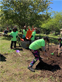 Students Shoveling Soil