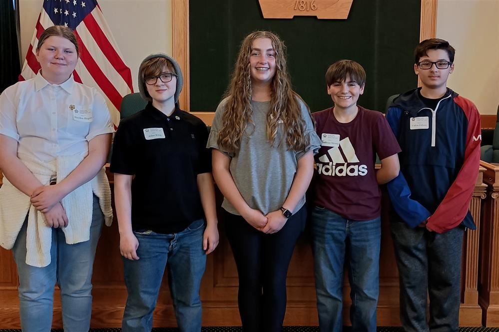  Fulton students pose in front of the county seal