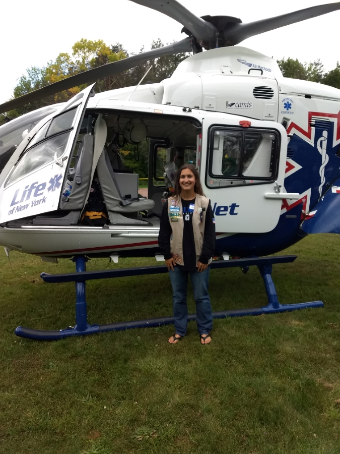 Rachel Germain in Girl Scout vest with medi-copter