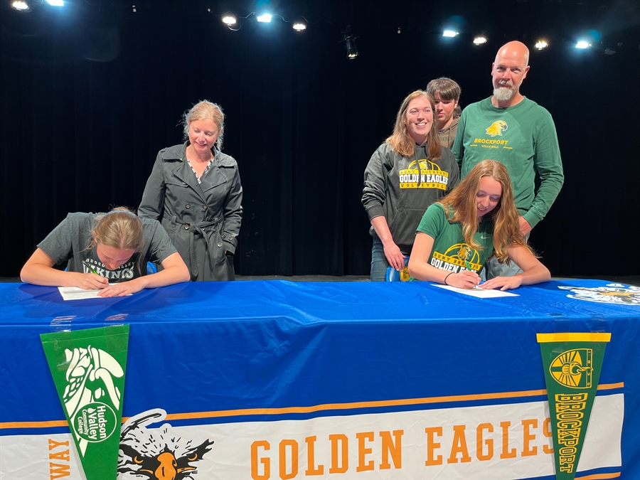 Emma and Julia signing