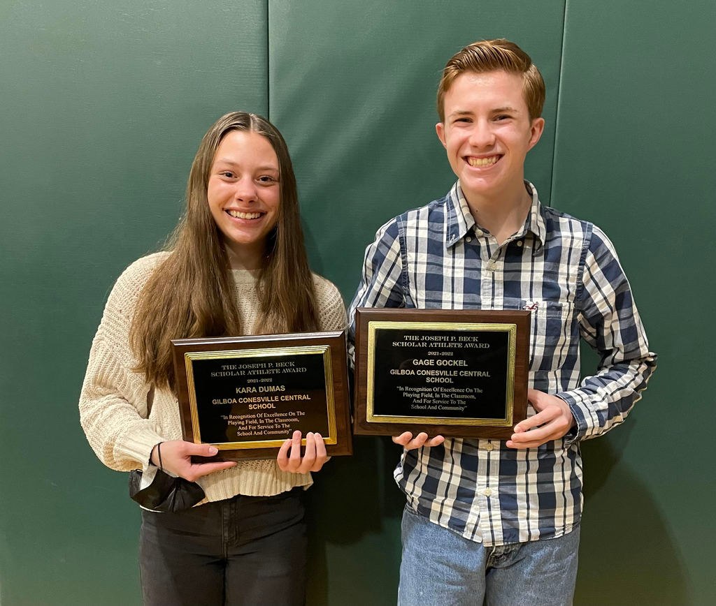 students holding their awards