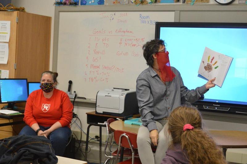 Gena Churchwell, a Glynn Academy teacher, shared with students Friday a book they created titled \"I Am Thankful For.\"