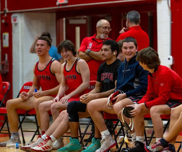 Glynn Academy wrestlers look on from the sideline during a match at The Glass Palace earlier this season.