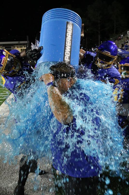 Brunswick High head coach Garrett Grady is doused in Powerade after leading the Pirates to victory in the City Championship game on Sept. 23 at Glynn County Stadium.