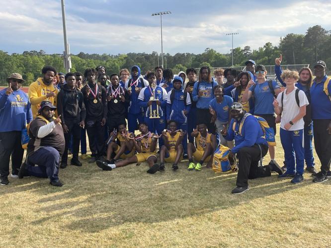 The Brunswick High boys track and field team poses for a photo after winning the program\'s first region championship since 1990 at the Region 2-6A meet on Wednesday in Evans.