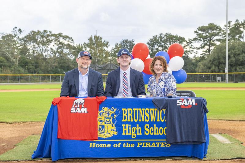 Brunswick’s Elijah Wellman is joined his parents as he signed he NLI to play college baseball at Samford University.