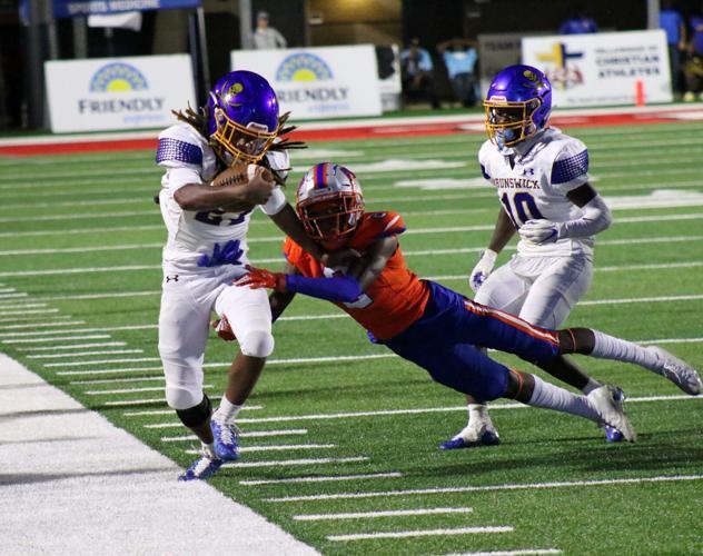 Brunswick High\'s Jamarious Towns carries the ball against The Bolles School at Glynn County Stadium.