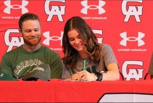 Glynn Academy\'s Isabella Albright signs her letter of intent during a signing ceremony.